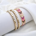 Bracelets dorés avec chevron tissé rose et fuchsia Pink Aura